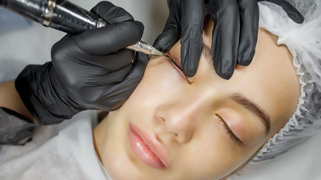 Permanent eyeliner being applied