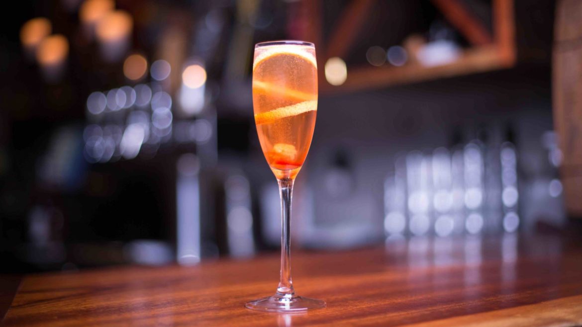 Low,Angle,Close,Up,On,A,Glass,Of,Sparkling,Champagne